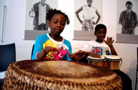 Children taking part in a drumming workshop on family fun day, June 2013, in the Irish Aid Volunteering and Information Centre, Dublin