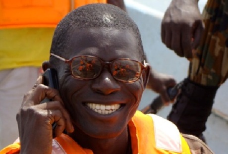 Joseph Musa, World Vision, with a mobile phone. Mobile phones are being used to improve healthcare for expectant and new mothers in Sierra Leone. Photo: Frédérique Vallieres