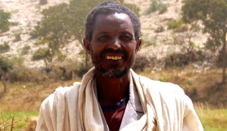 GebreMariam Desalegn stands on his farm in Tigray, Northern Ethiopia. 
